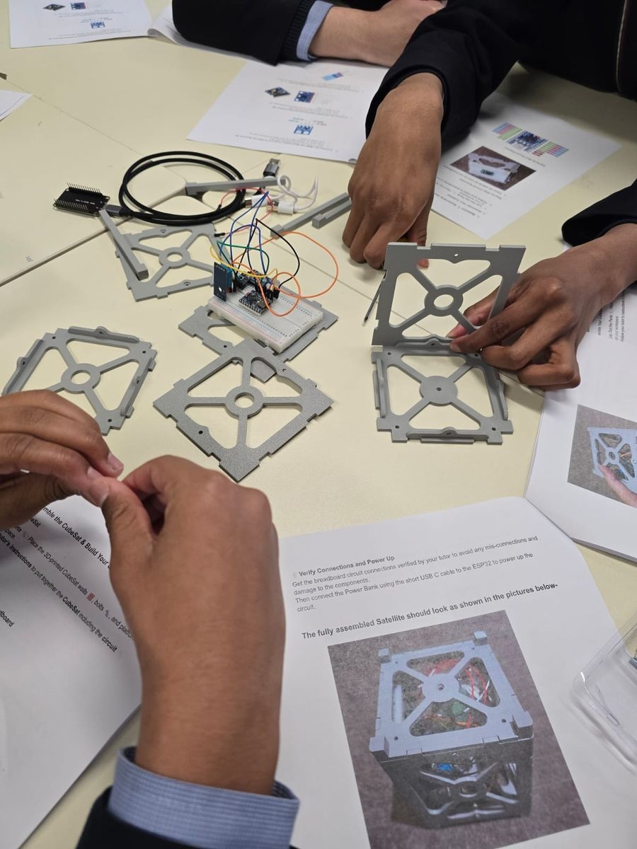 students building cubesat